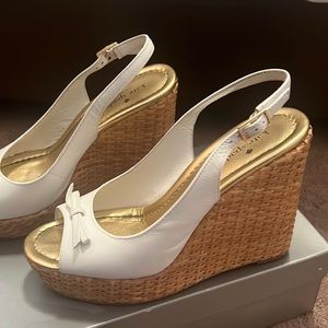 Used Kate Spade size 9.5 white wedges